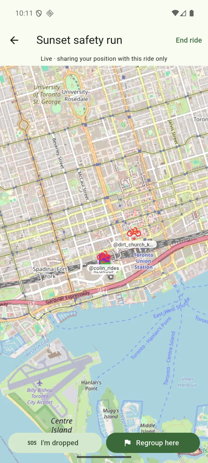 Live group map during a ride, showing crew rider positions, a regroup flag, and one-tap safety buttons